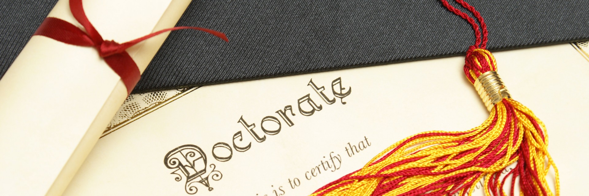 Doctorate degree with a graduation cap